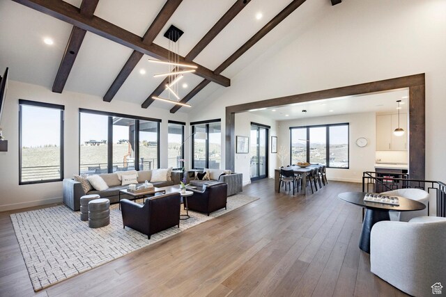 6633 Golden Bear Loop W, Park City, UT 84098 - living area with baseboards, beamed ceiling, and high vaulted ceiling