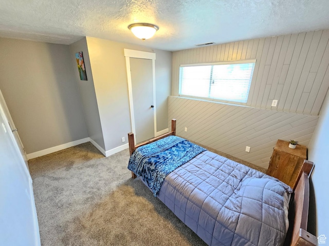 3500 W 6875 S, West Jordan, UT 84084 - carpeted bedroom with a textured ceiling, baseboards, and wood walls