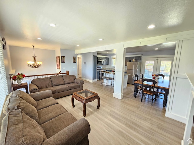 3500 W 6875 S, West Jordan, UT 84084 - living room with a chandelier, light wood-style flooring, and recessed lighting