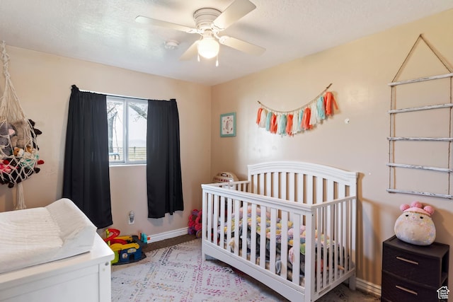 4710 W 2200 N, Plain City, UT 84404 - bedroom featuring carpet flooring, ceiling fan, baseboards, and a crib