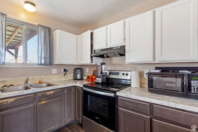 4710 W 2200 N, Plain City, UT 84404 - kitchen featuring white cabinets, a sink, electric stove, under cabinet range hood, and black microwave