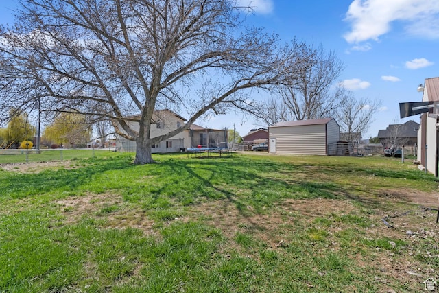 4710 W 2200 N, Plain City, UT 84404 - view of yard with a trampoline, an outdoor structure, fence, and a storage unit