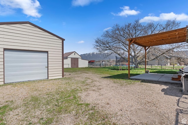 4710 W 2200 N, Plain City, UT 84404 - view of yard with a trampoline, fence, and an outbuilding