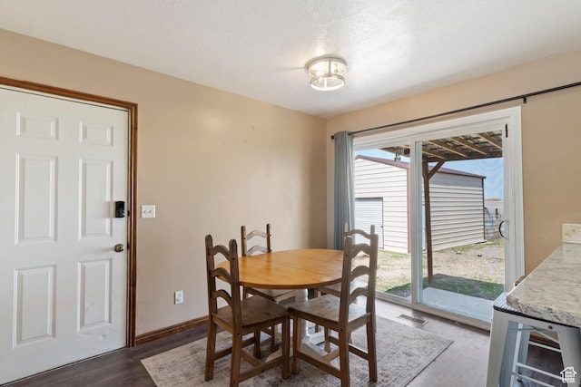 4710 W 2200 N, Plain City, UT 84404 - dining area featuring dark wood-type flooring, visible vents, baseboards, and wine cooler