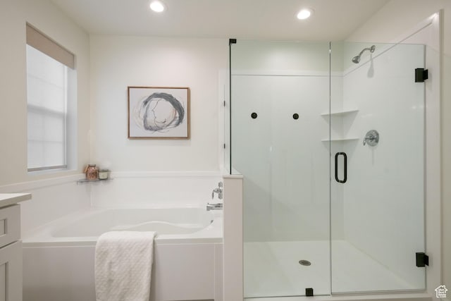 bathroom featuring a shower stall, recessed lighting, vanity, and a garden tub