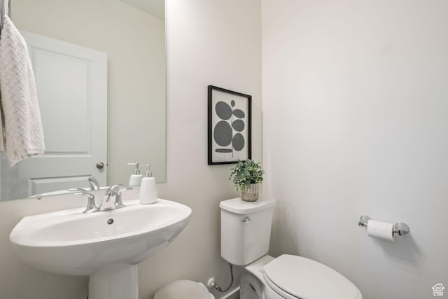 bathroom featuring a sink and toilet