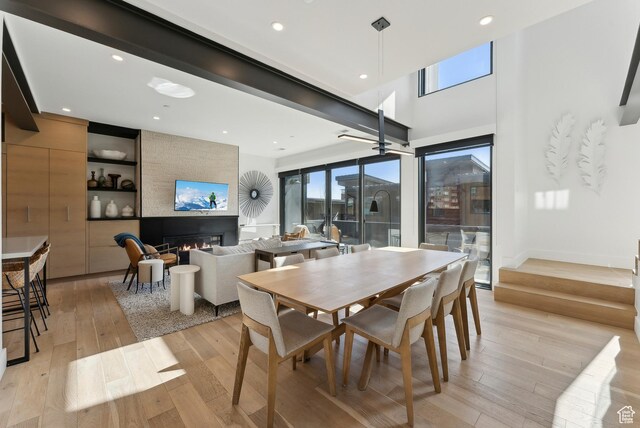 3595 Ridgeline Dr, Park City, UT 84098 - dining room with recessed lighting, a fireplace, and light wood finished floors