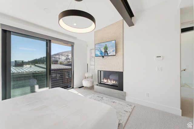 3595 Ridgeline Dr, Park City, UT 84098 - bedroom with access to outside, a large fireplace, baseboards, carpet floors, and beamed ceiling