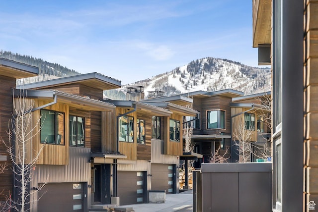 3595 Ridgeline Dr, Park City, UT 84098 - exterior space featuring an attached garage, a mountain view, and driveway