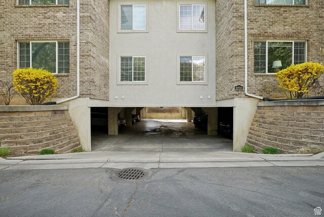 exterior space with a carport and driveway
