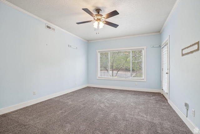 unfurnished bedroom featuring visible vents, baseboards, a textured ceiling, crown molding, and carpet floors