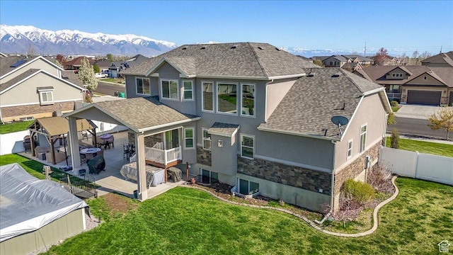 back of house with a patio area, a fenced backyard, a residential view, and stucco siding