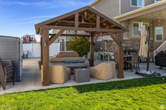 view of patio with a gazebo and fence