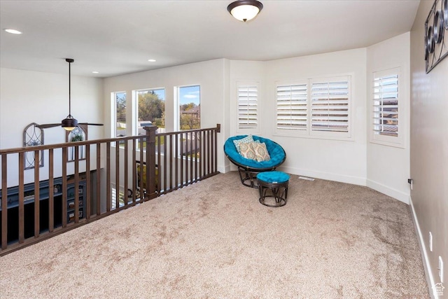 interior space featuring carpet floors, baseboards, a ceiling fan, and recessed lighting