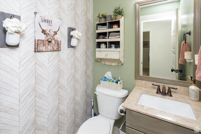 bathroom with toilet and vanity