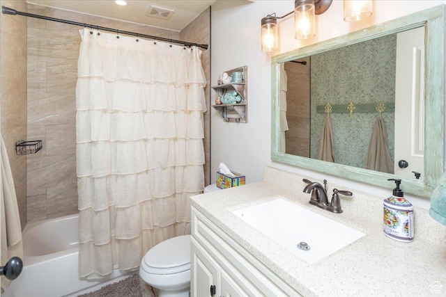 bathroom with toilet, vanity, shower / tub combo with curtain, and visible vents