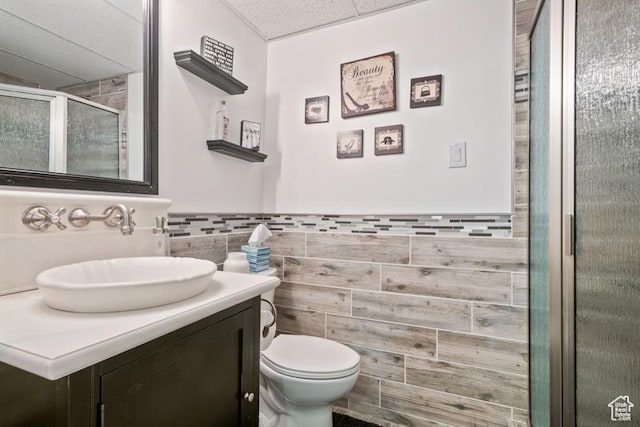 8366 S Cobble Cir W, West Jordan, UT 84081 - full bath featuring a shower stall, toilet, vanity, and tile walls