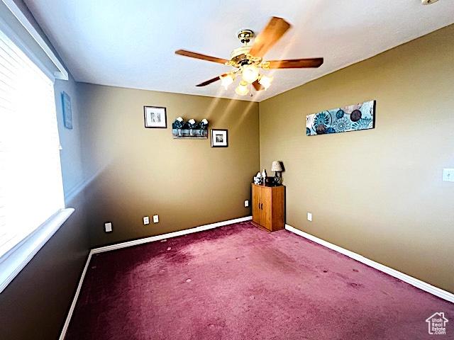8366 S Cobble Cir W, West Jordan, UT 84081 - carpeted spare room featuring a ceiling fan and baseboards