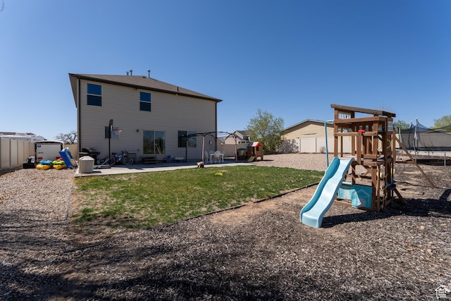 583 E 2680 S, Vernal, UT 84078 - rear view of house featuring a patio, a fenced backyard, a playground, and a lawn