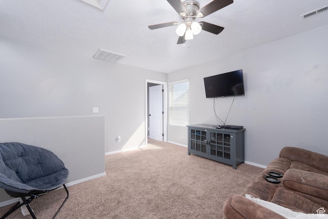 583 E 2680 S, Vernal, UT 84078 - living area with carpet flooring, visible vents, baseboards, and a ceiling fan