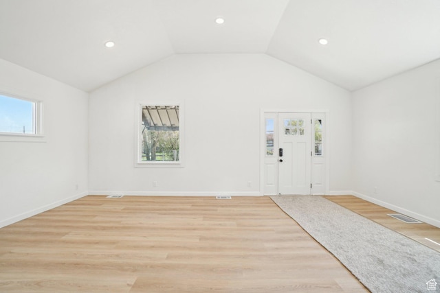 entryway with recessed lighting, light wood finished floors, visible vents, and lofted ceiling