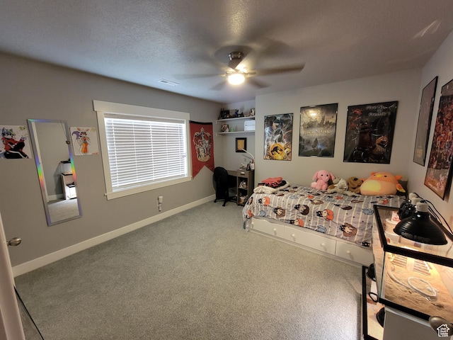 carpeted bedroom featuring baseboards, a ceiling fan, and visible vents