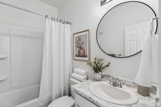 full bathroom with shower / bathtub combination with curtain, vanity, and toilet