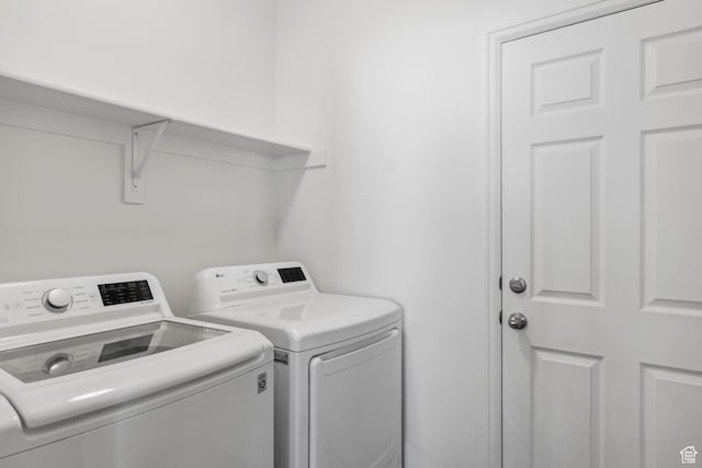 laundry area with laundry area and separate washer and dryer