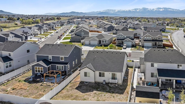 birds eye view of property featuring a mountain view and a residential view
