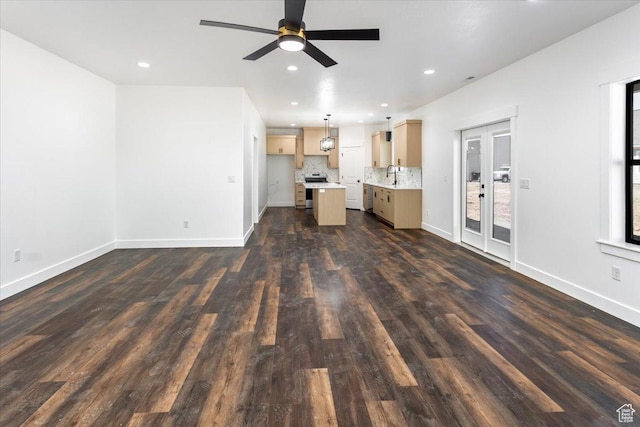 432 Tee Cir, Preston, ID 83263 - unfurnished living room featuring baseboards, recessed lighting, dark wood-style floors, ceiling fan, and a sink
