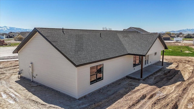 432 Tee Cir, Preston, ID 83263 - back of property with roof with shingles, a mountain view, and a residential view