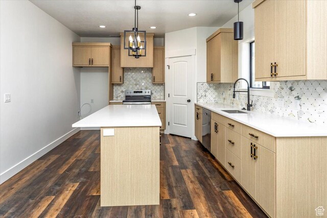 432 Tee Cir, Preston, ID 83263 - kitchen with a sink, light countertops, appliances with stainless steel finishes, a chandelier, and backsplash