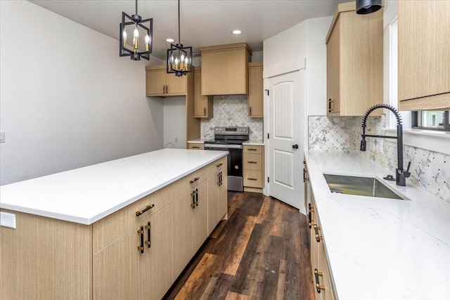 432 Tee Cir, Preston, ID 83263 - kitchen with dark wood-style flooring, light stone counters, stainless steel electric stove, decorative backsplash, and a sink