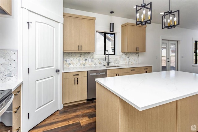 432 Tee Cir, Preston, ID 83263 - kitchen featuring a notable chandelier, a sink, appliances with stainless steel finishes, dark wood finished floors, and decorative backsplash