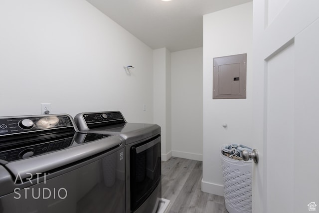 790 E Ruby Dr, Morgan, UT 84050 - laundry room with laundry area, light wood-style flooring, electric panel, washer and dryer, and baseboards