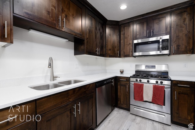 790 E Ruby Dr, Morgan, UT 84050 - kitchen featuring a sink, light countertops, appliances with stainless steel finishes, and dark brown cabinetry
