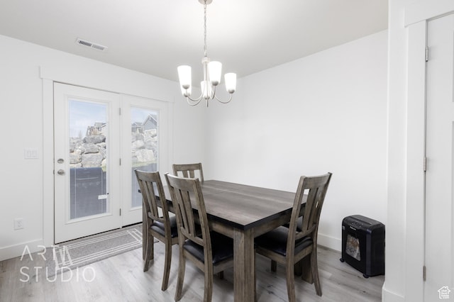 790 E Ruby Dr, Morgan, UT 84050 - dining area featuring a chandelier, light wood-style floors, baseboards, and visible vents