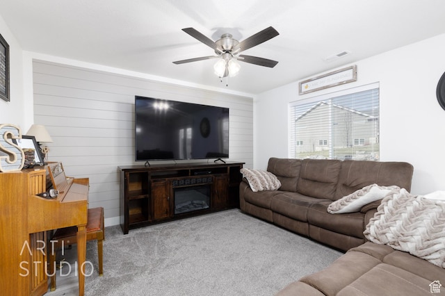 790 E Ruby Dr, Morgan, UT 84050 - carpeted living room with wood walls, a ceiling fan, and visible vents