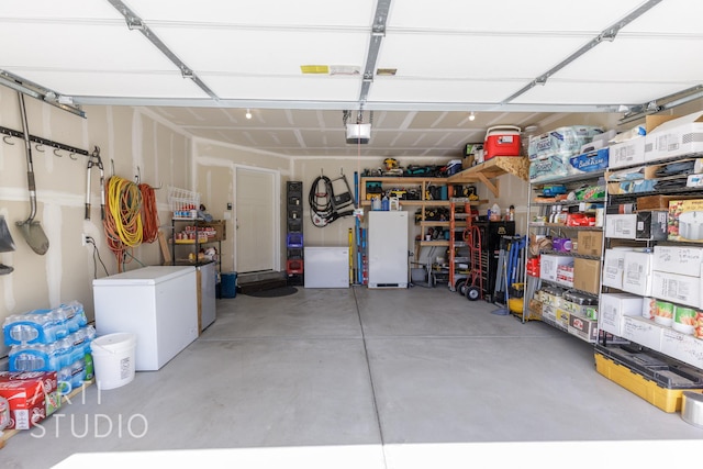 790 E Ruby Dr, Morgan, UT 84050 - garage featuring refrigerator and a garage door opener