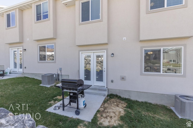 790 E Ruby Dr, Morgan, UT 84050 - rear view of house with a lawn, cooling unit, a patio, stucco siding, and french doors