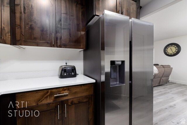 790 E Ruby Dr, Morgan, UT 84050 - kitchen featuring light wood-style floors, stainless steel fridge with ice dispenser, dark brown cabinets, light countertops, and baseboards