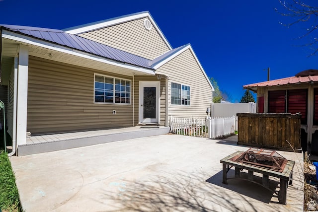1370 S 1900 E, Vernal, UT 84078 - back of property featuring metal roof, fence, and a patio