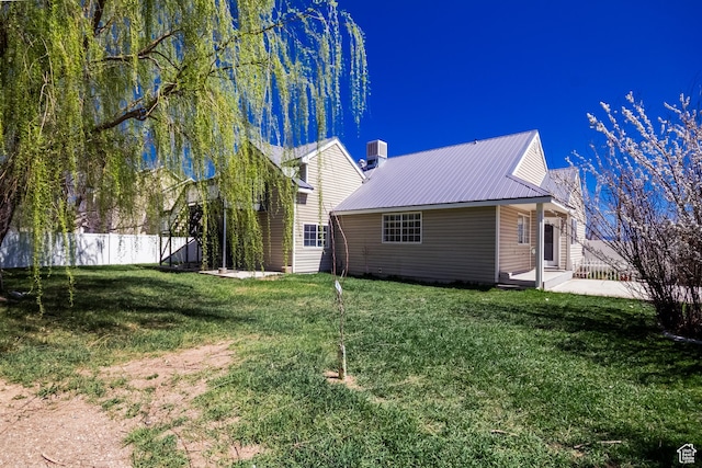 1370 S 1900 E, Vernal, UT 84078 - rear view of property with central air condition unit, a yard, metal roof, and fence