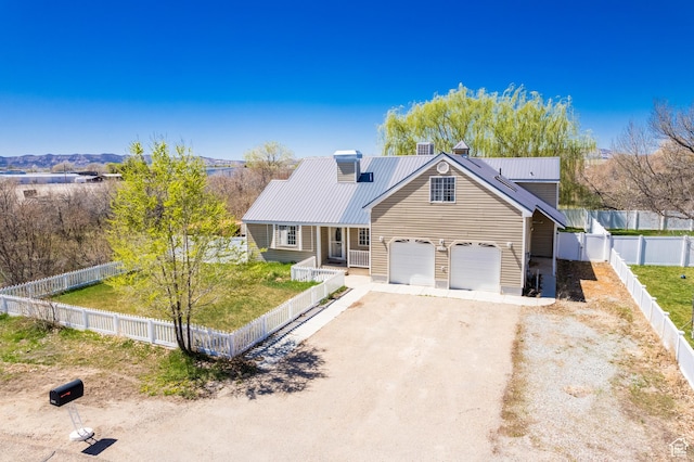 1370 S 1900 E, Vernal, UT 84078 - view of front facade with metal roof, a chimney, a fenced backyard, a front lawn, and driveway