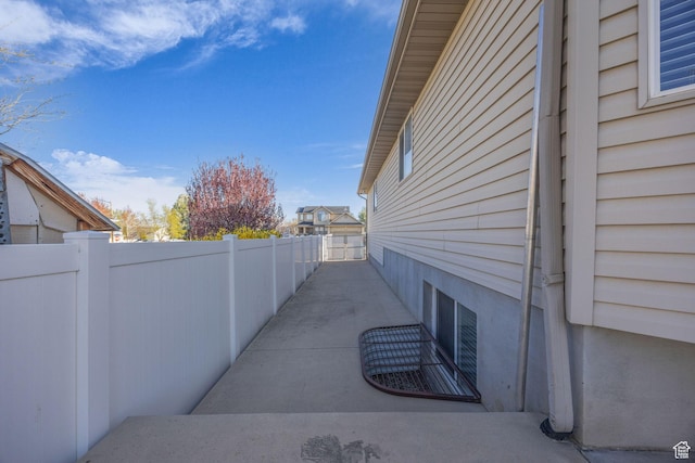 view of side of property with fence