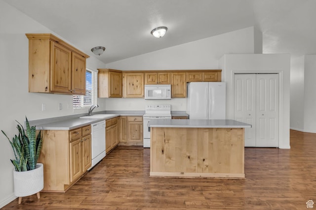 kitchen with dark wood finished floors, white appliances, a sink, and lofted ceiling
