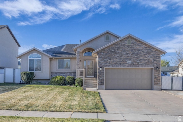 ranch-style home featuring a gate, driveway, an attached garage, a front lawn, and fence