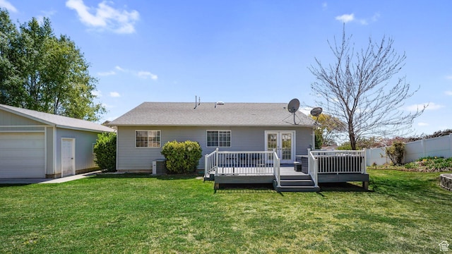 back of property with a lawn, fence, cooling unit, french doors, and a wooden deck