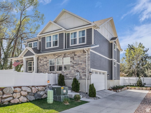 1958 E Janet Kay Ln, Holladay, UT 84121 - view of front of home featuring stone siding, a garage, fence, central air condition unit, and driveway