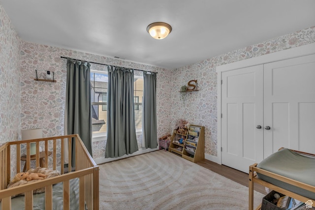 1958 E Janet Kay Ln, Holladay, UT 84121 - bedroom with visible vents, a closet, baseboards, wood finished floors, and wallpapered walls